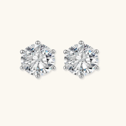 Close-up of round brilliant-cut moissanite stud earrings in 6-prong sterling silver settings showing exceptional sparkle