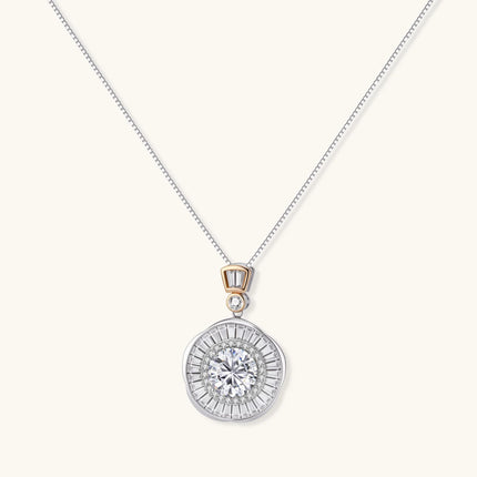 Sterling silver necklace with circular geometric pendant featuring central moissanite and radial baguette pattern.