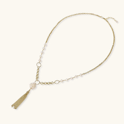 Long gold-plated necklace with freshwater pearls, chunky chain links, and flowing tassel pendant