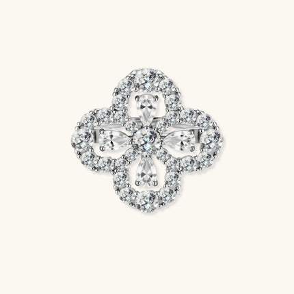 Adjustable sterling silver ring with quatrefoil design featuring brilliant moissanite stones in clover pattern