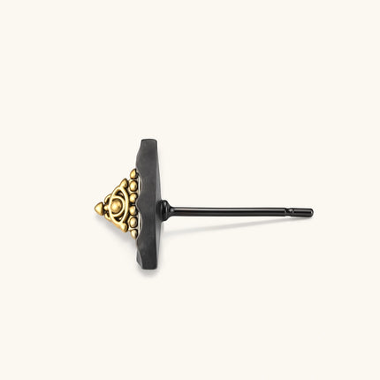 Single triangle stud earring with dark gunmetal outer frame and raised 18K gold-plated ornamental center, post back.