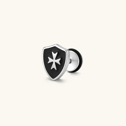 Silver stainless steel shield-shaped stud earring with black enamel and raised Maltese cross, rubber-secured backing.