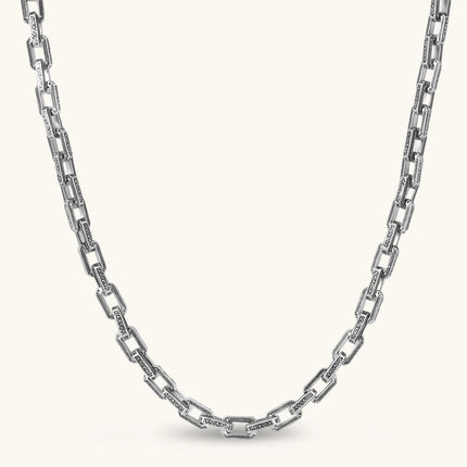 Silver 316L stainless steel rectangular link chain necklace with intricate scroll engravings, 560mm length, 7.1mm width.