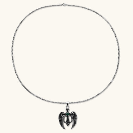 Silver stainless steel angel wing cross pendant necklace with green CZ center stone and black crystals on a box chain.